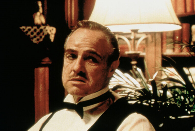 A portrait photo of Vito Corleone